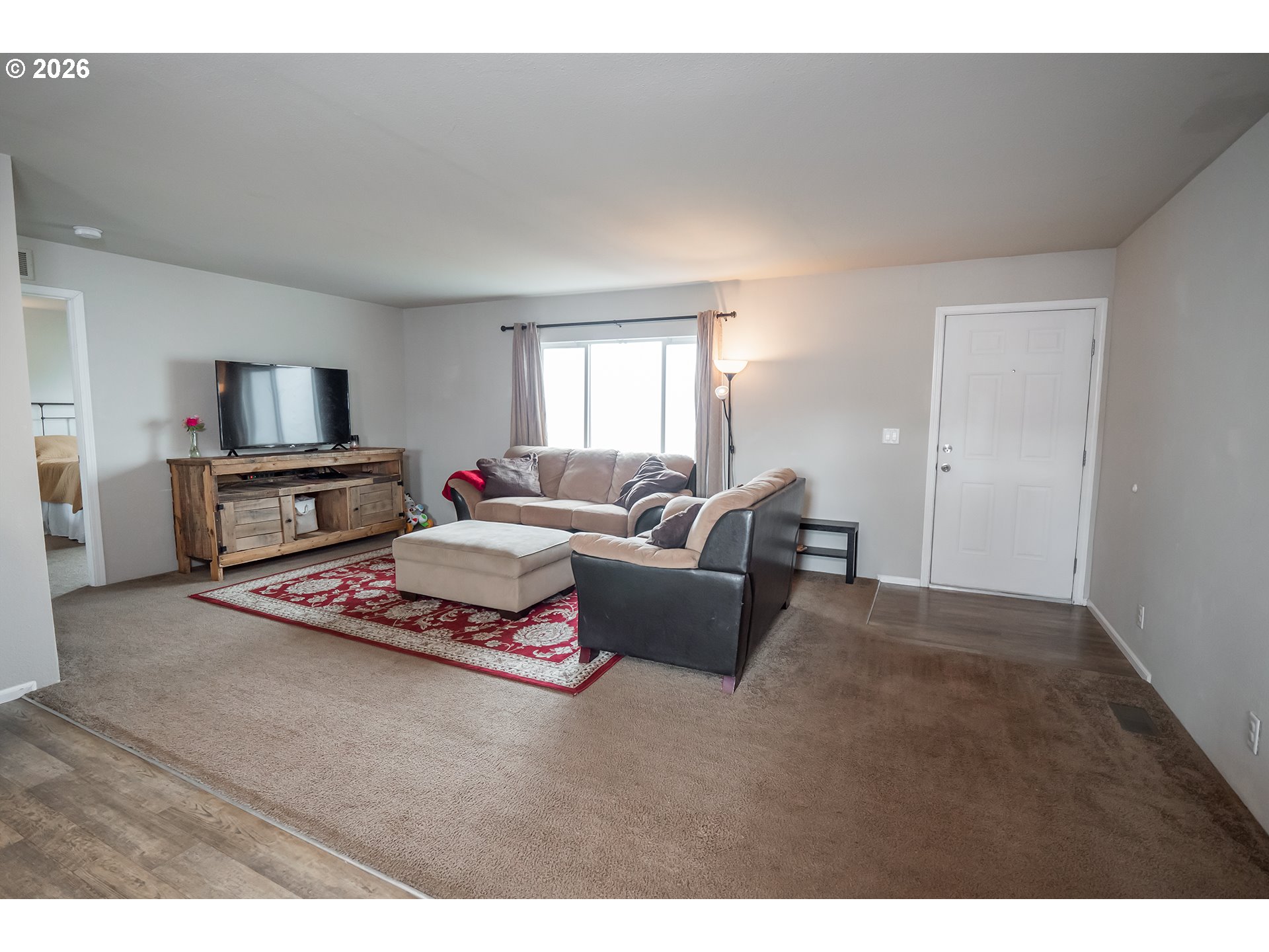 628 Stanley Lane Harrisburg, OR 97446 - Photo 7 of 32 a living room with furniture and a flat screen tv