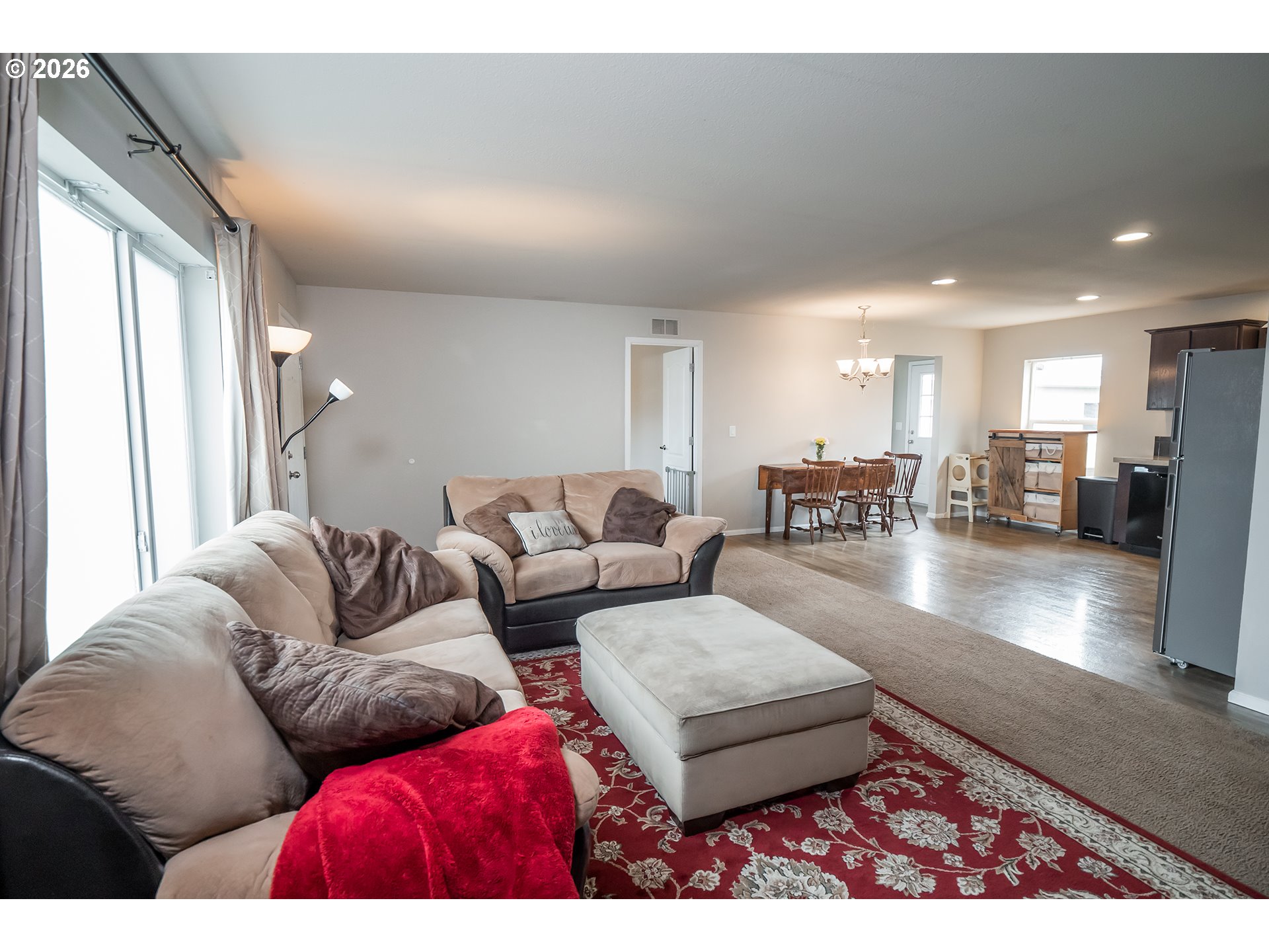 628 Stanley Lane Harrisburg, OR 97446 - Photo 8 of 32 a living room with furniture and a large window