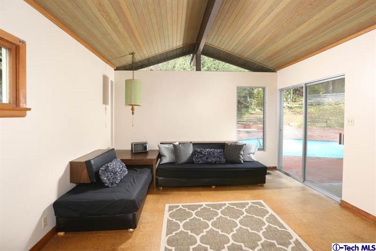 1011 Hillside Terrace Pasadena, CA 91105 - Photo 17 of 32 a living room with furniture and a floor to ceiling window