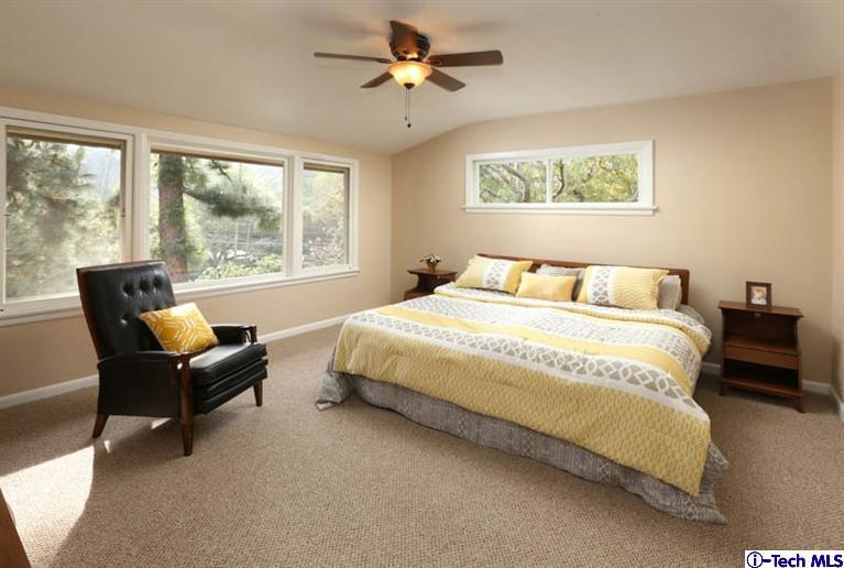 1011 Hillside Terrace Pasadena, CA 91105 - Photo 19 of 32 a bedroom with a bed a couch and a large window