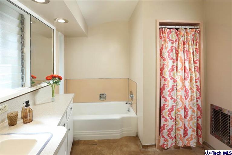 1011 Hillside Terrace Pasadena, CA 91105 - Photo 20 of 32 a bathroom with a tub sink and mirror