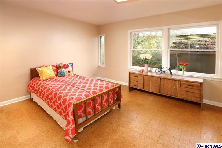 1011 Hillside Terrace Pasadena, CA 91105 - Photo 22 of 32 a bedroom with a bed and window