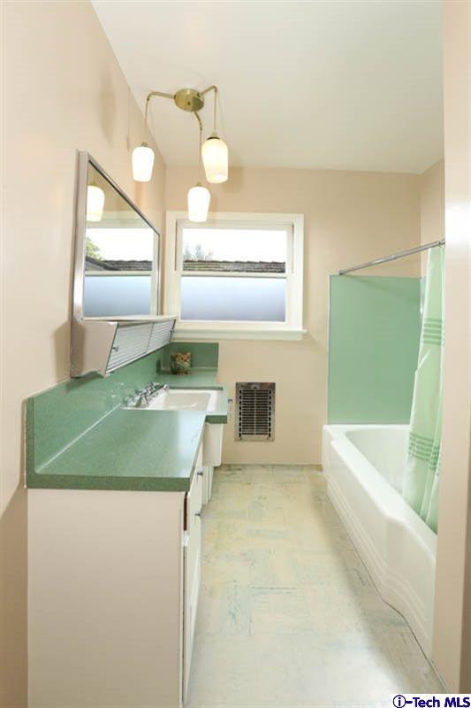 1011 Hillside Terrace Pasadena, CA 91105 - Photo 23 of 32 a bathroom with a sink and a mirror