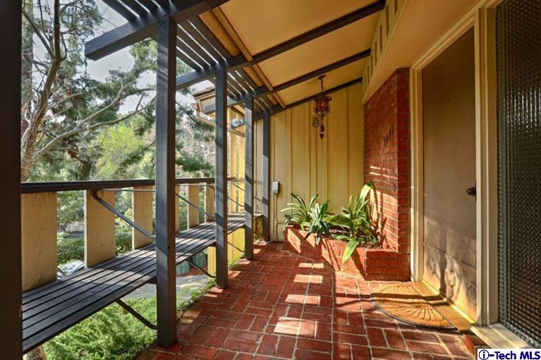 1011 Hillside Terrace Pasadena, CA 91105 - Photo 7 of 32 a balcony with wooden floor and furniture