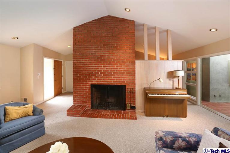 1011 Hillside Terrace Pasadena, CA 91105 - Photo 8 of 32 a living room with furniture and a fireplace