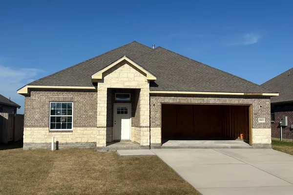 a front view of a house with a garage