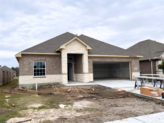 a front view of a house with yard and flat screen tv