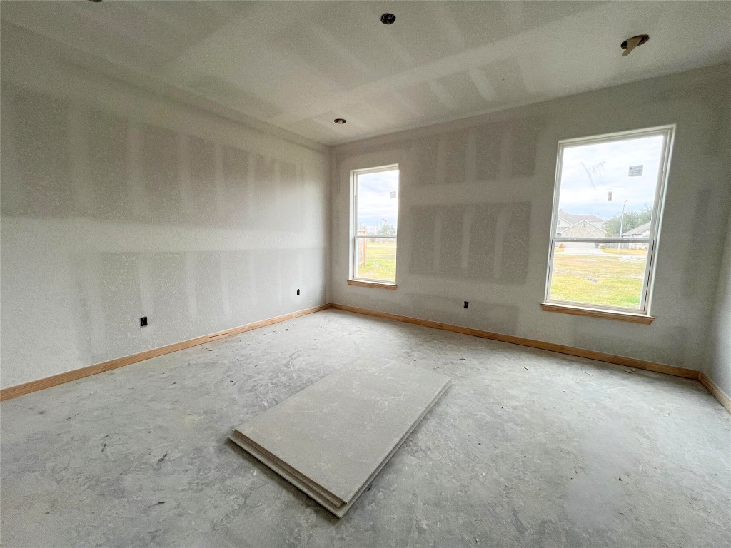 15822 Sugar Maple Lane Santa Fe, TX 77517 - Photo 8 of 8 an empty room with windows