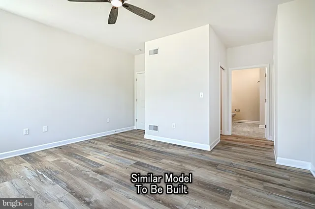 a bedroom with a bed and a chair