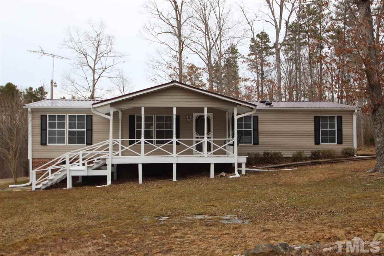 465 Melton Road Roxboro, NC 27574 - Photo 1 of 11 front view of a house with a yard