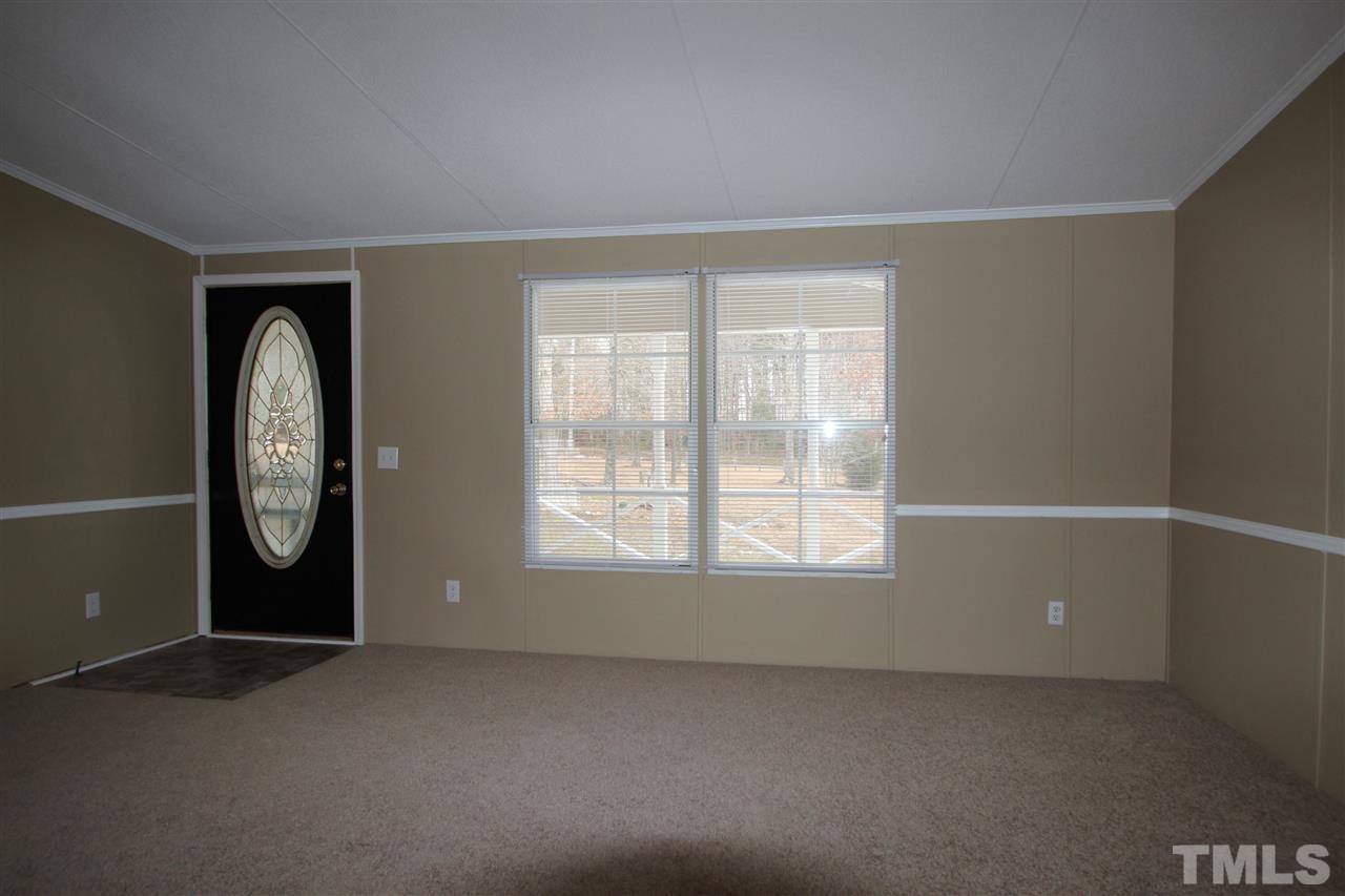 465 Melton Road Roxboro, NC 27574 - Photo 6 of 11 an empty room with windows