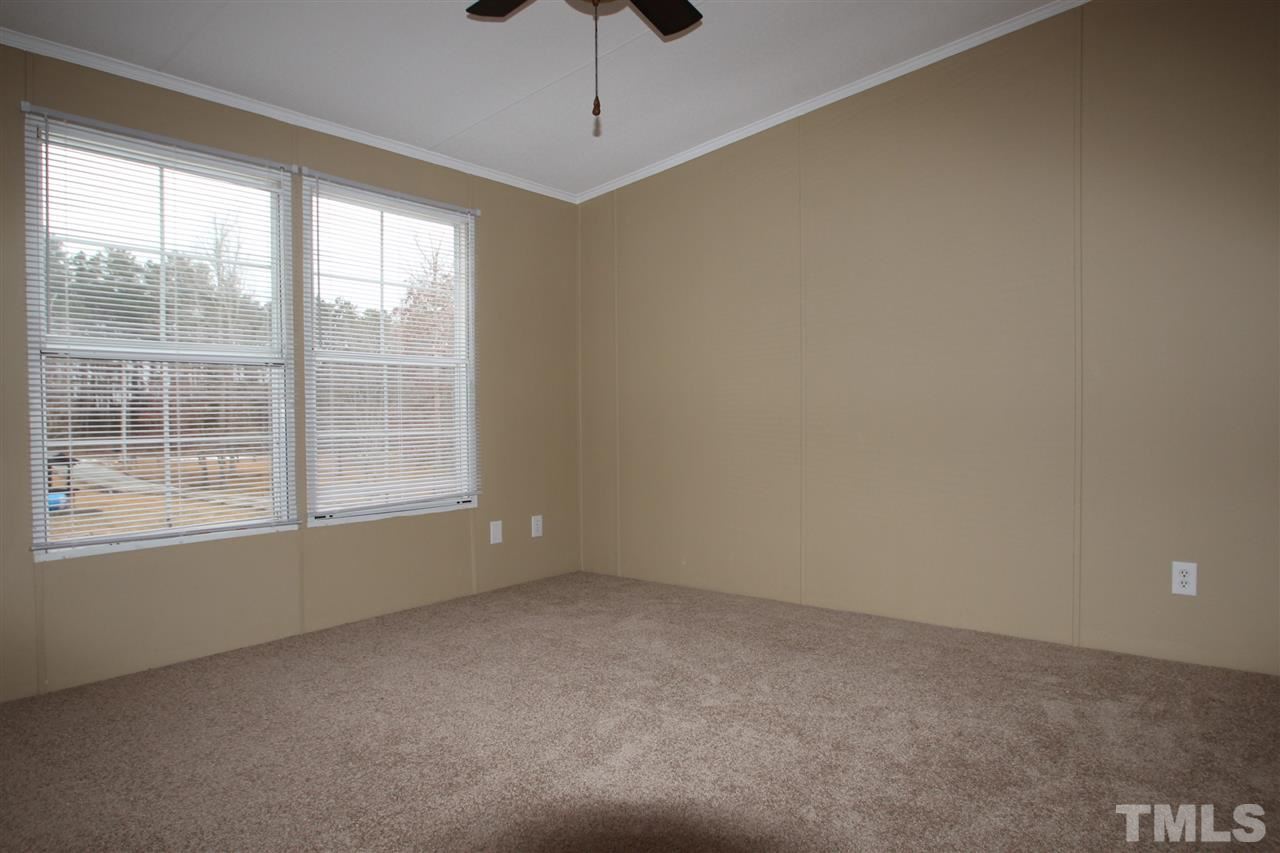 465 Melton Road Roxboro, NC 27574 - Photo 7 of 11 an empty room with a window