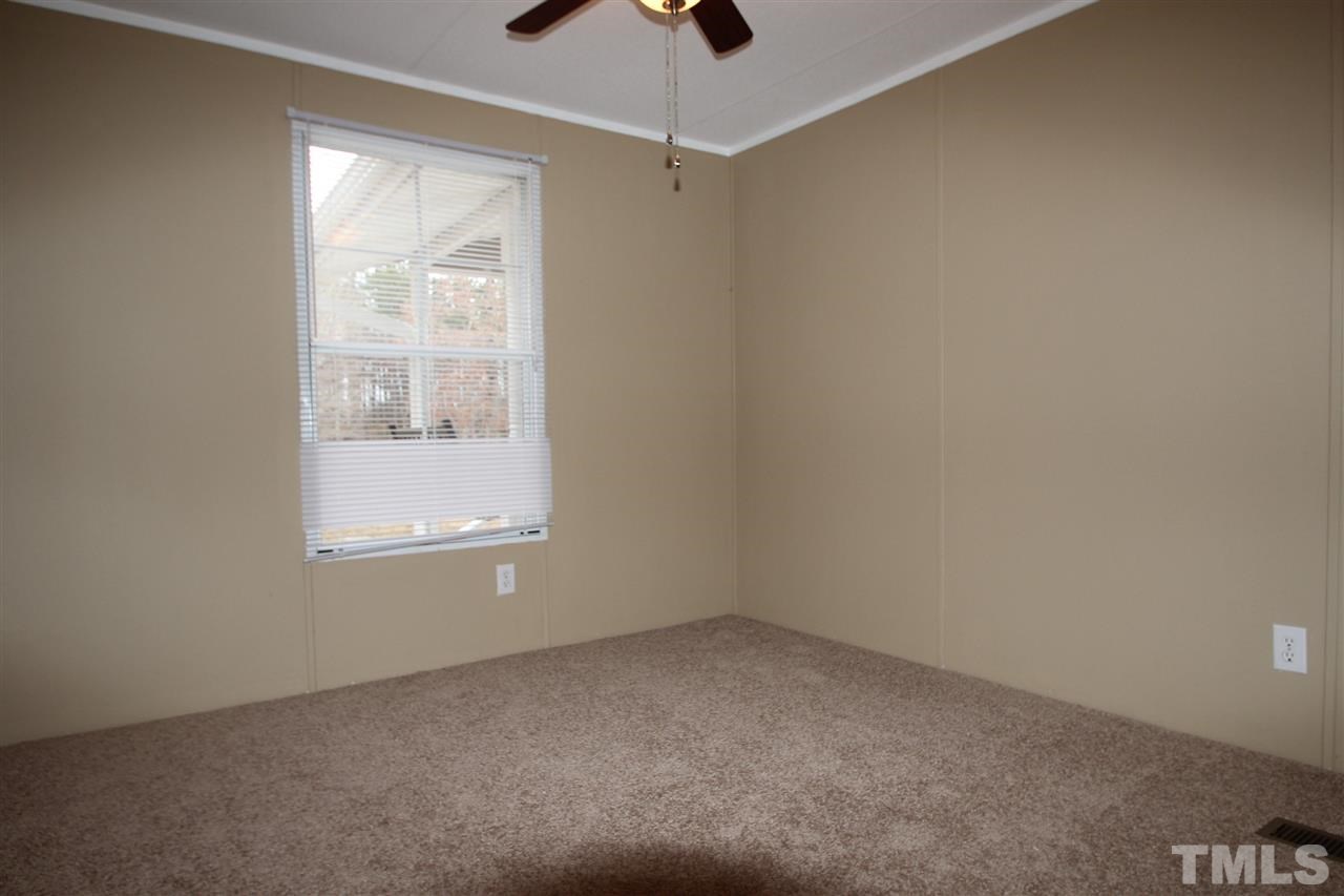 465 Melton Road Roxboro, NC 27574 - Photo 9 of 11 an empty room with a window