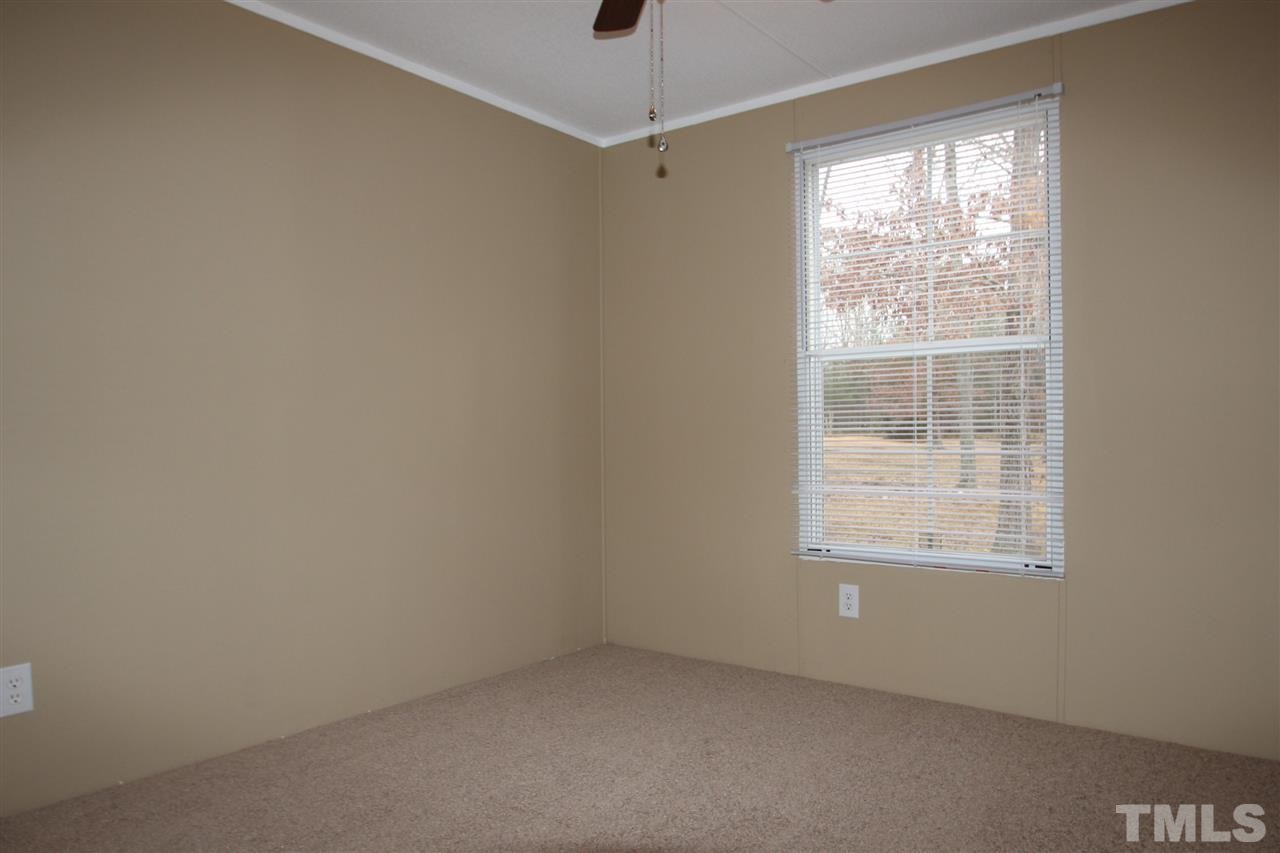 465 Melton Road Roxboro, NC 27574 - Photo 10 of 11 an empty room with a window