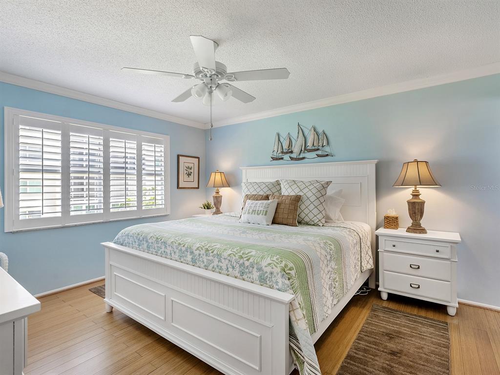 230 Santa Maria Street, Unit 234 Venice, FL 34285 - Photo 18 of 60 a bedroom with a bed and window