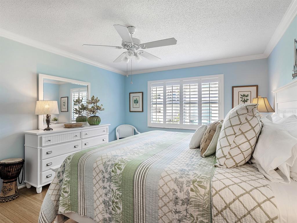 230 Santa Maria Street, Unit 234 Venice, FL 34285 - Photo 19 of 60 a bedroom with a large bed and a window