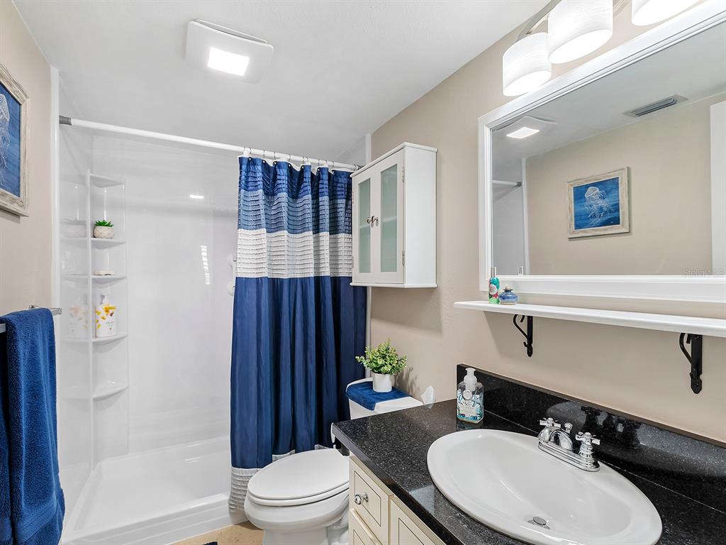 230 Santa Maria Street, Unit 234 Venice, FL 34285 - Photo 20 of 60 a bathroom with a sink toilet and shower