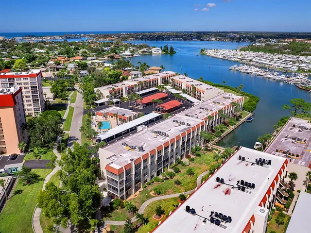 an aerial view of a house with a ocean view