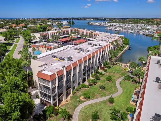 an aerial view of residential building and lake