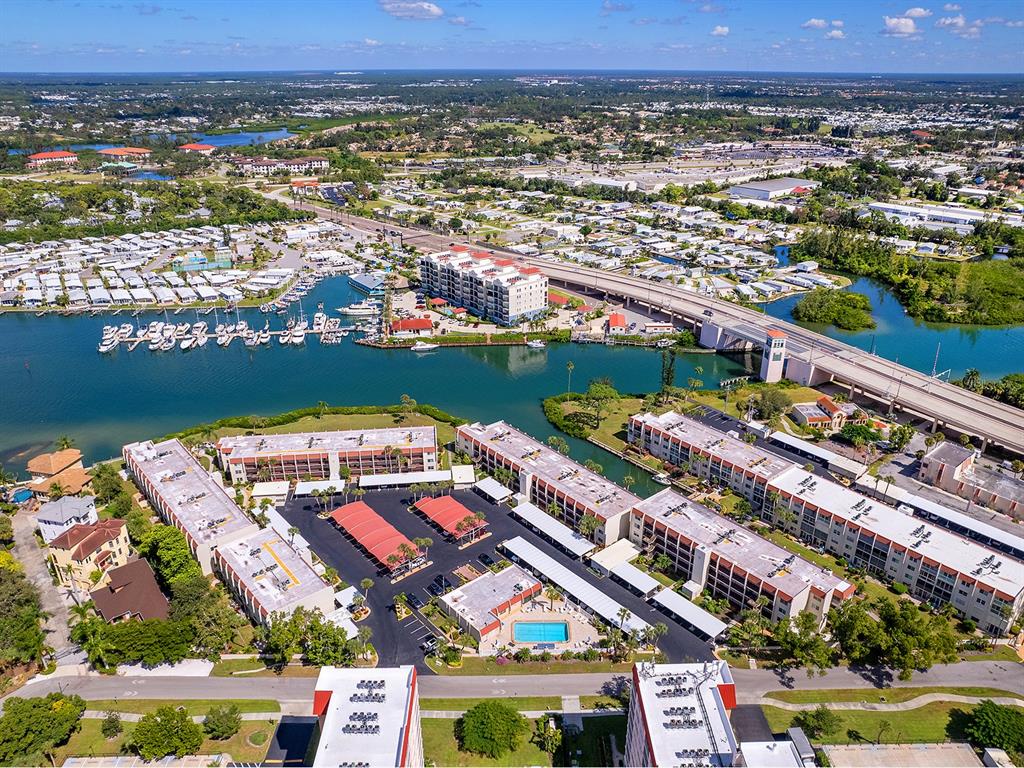 230 Santa Maria Street, Unit 234 Venice, FL 34285 - Photo 35 of 60 an aerial view of residential building and lake