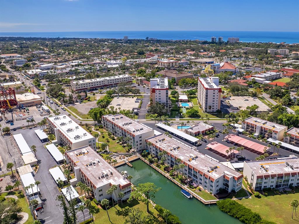 230 Santa Maria Street, Unit 234 Venice, FL 34285 - Photo 38 of 60 an aerial view of residential houses with outdoor space