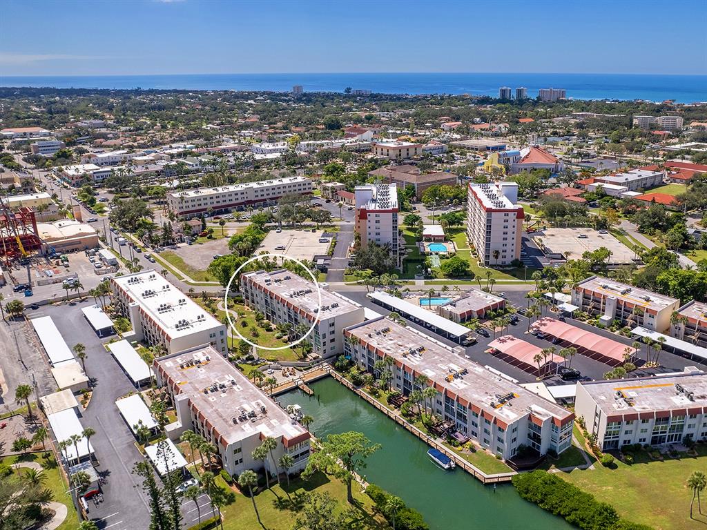 230 Santa Maria Street, Unit 234 Venice, FL 34285 - Photo 39 of 60 an aerial view of residential houses with outdoor space