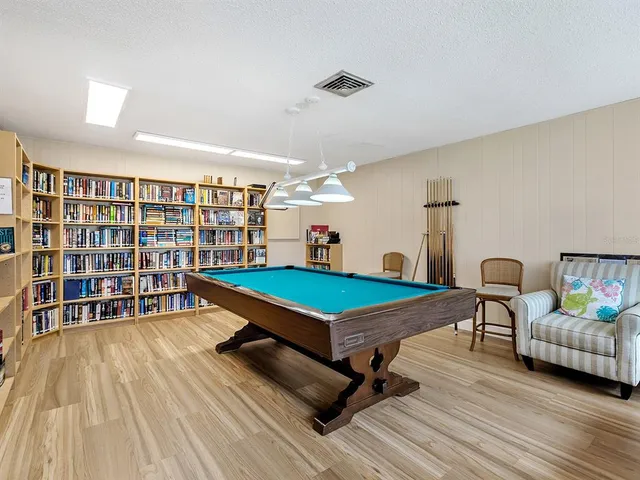 a view of a lake with a table and chairs