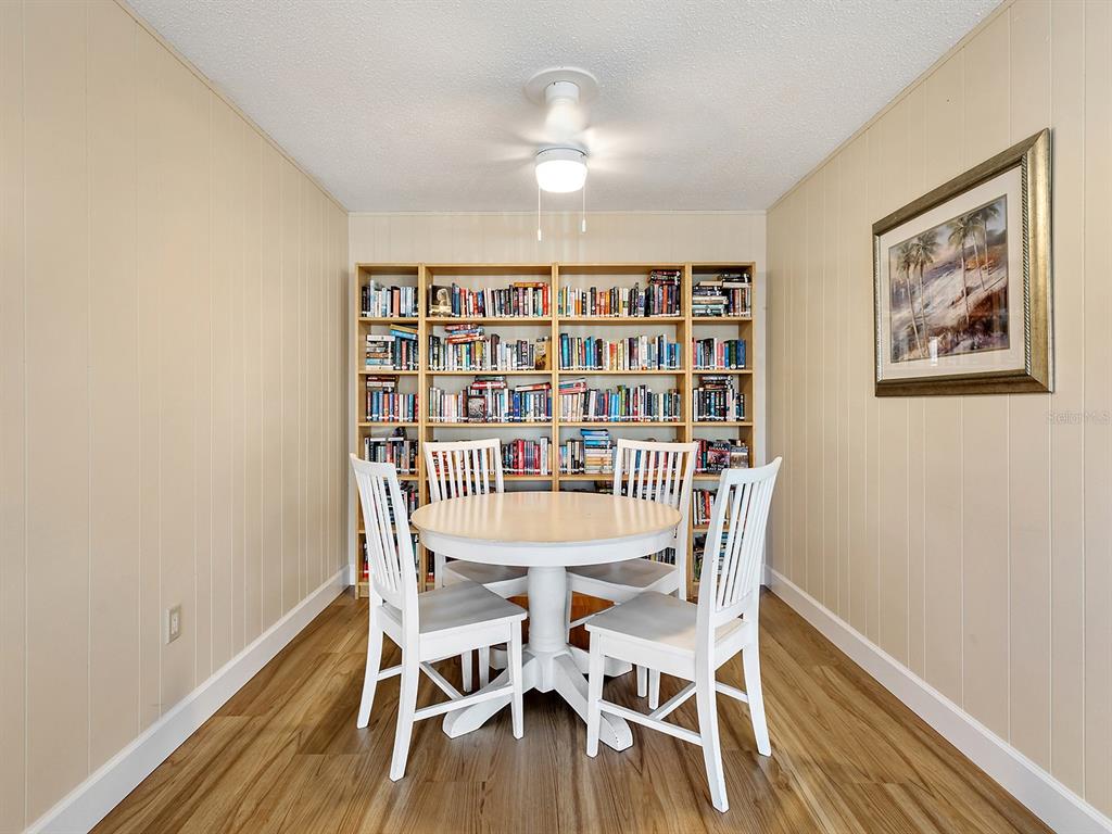 230 Santa Maria Street, Unit 234 Venice, FL 34285 - Photo 50 of 60 a view of a workspace with furniture and wooden floor