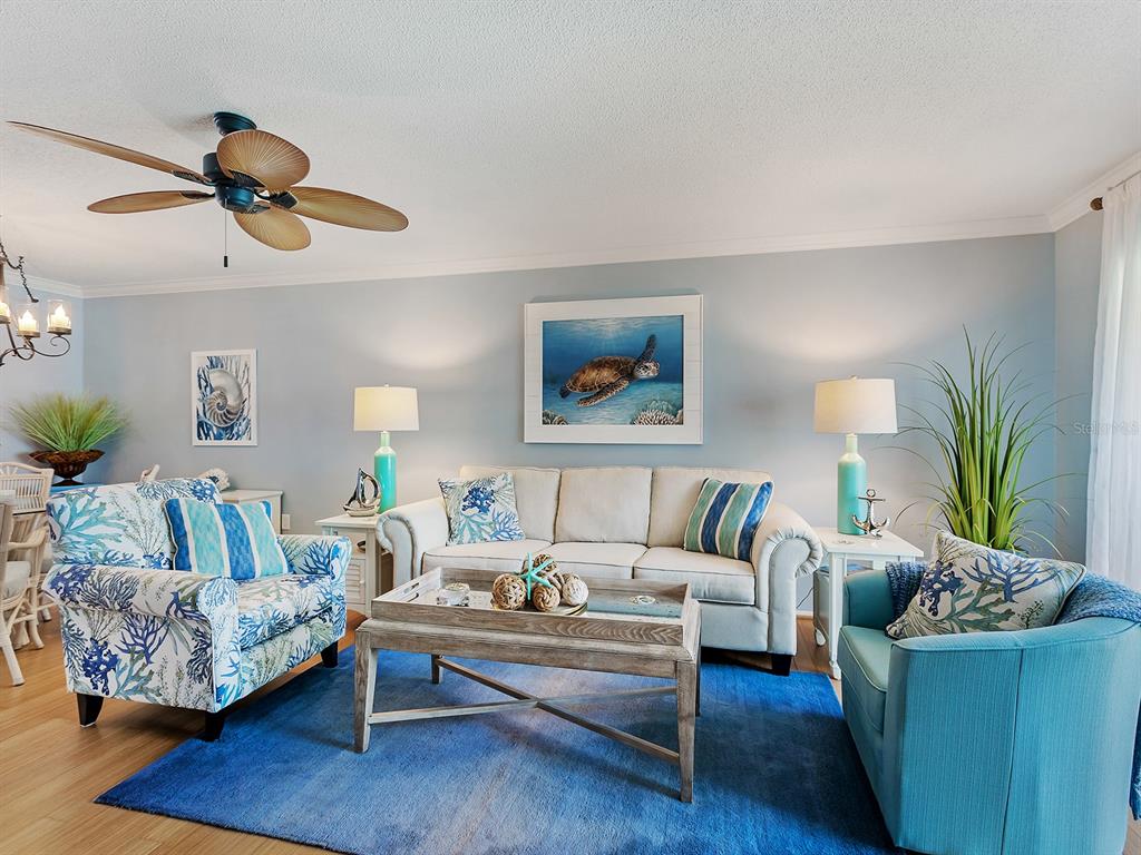 230 Santa Maria Street, Unit 234 Venice, FL 34285 - Photo 5 of 60 a living room with furniture and wooden floor