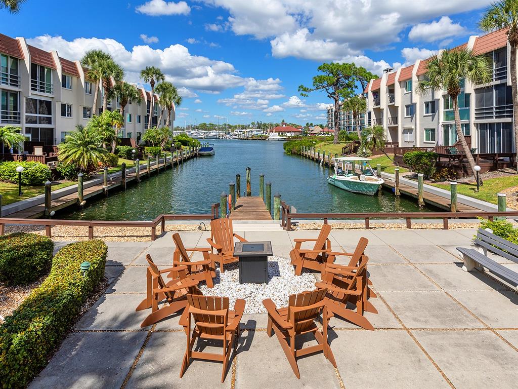 230 Santa Maria Street, Unit 234 Venice, FL 34285 - Photo 51 of 60 a view of a lake with couches and city view