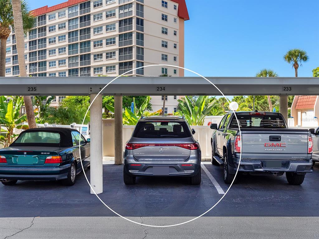 230 Santa Maria Street, Unit 234 Venice, FL 34285 - Photo 52 of 60 a view of a cars park in front of a building