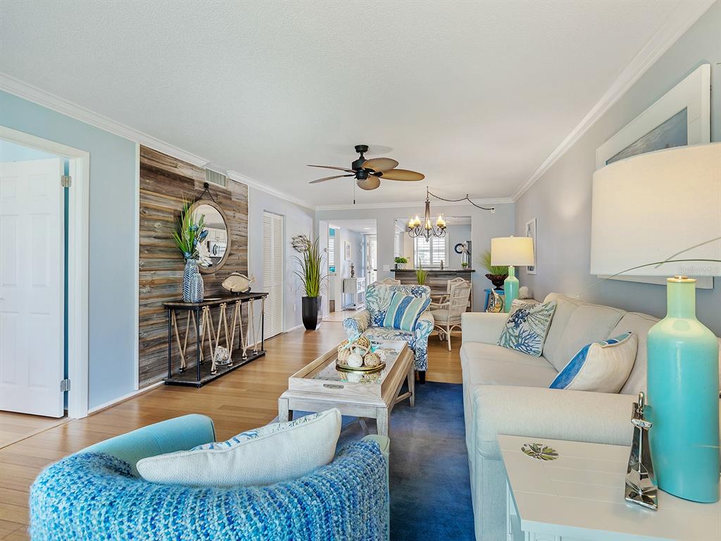 230 Santa Maria Street, Unit 234 Venice, FL 34285 - Photo 7 of 60 a living room with furniture fireplace and a window