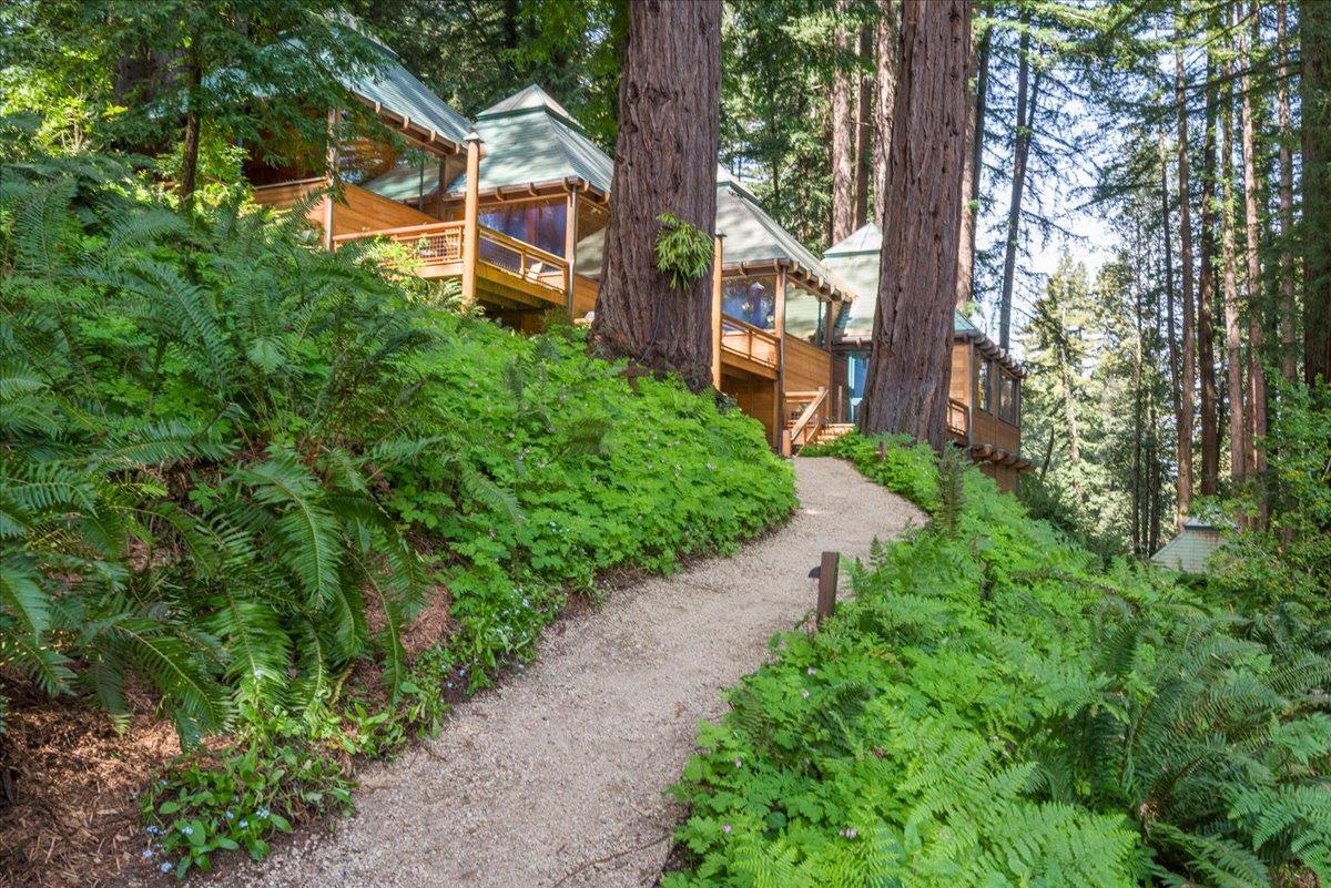 9 Summit Road Woodside, CA 94062 - Photo 14 of 38 a front view of a house with a yard and fountain