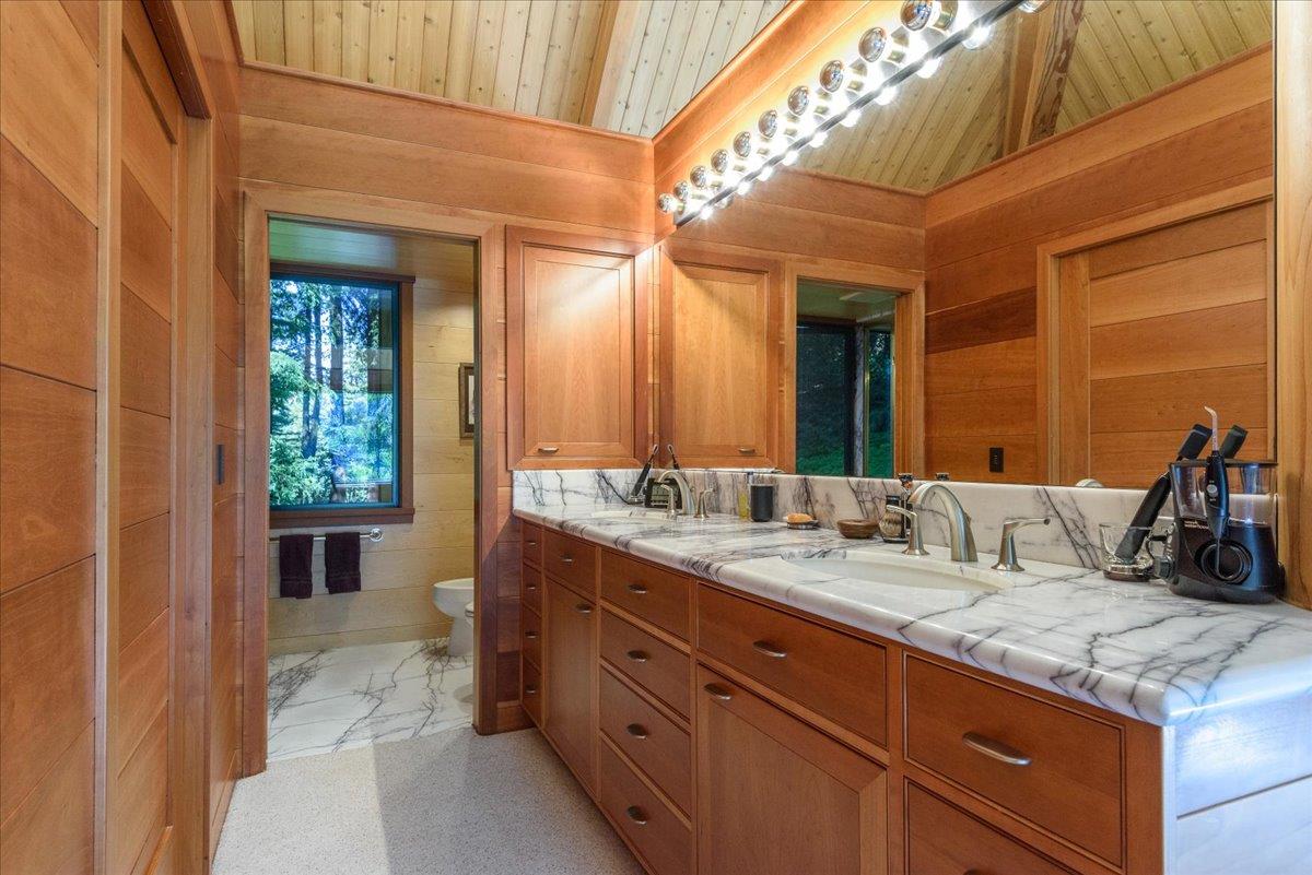 9 Summit Road Woodside, CA 94062 - Photo 16 of 38 a bathroom with a granite countertop sink and a mirror
