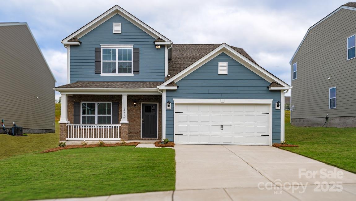 269 Shorthorn Road Fletcher, NC 28732 - Photo 1 of 23 a front view of a house with a yard