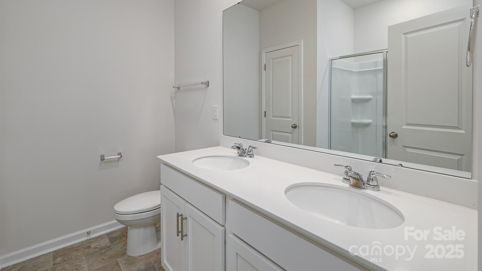 269 Shorthorn Road Fletcher, NC 28732 - Photo 18 of 23 a bathroom with a sink and a toilet