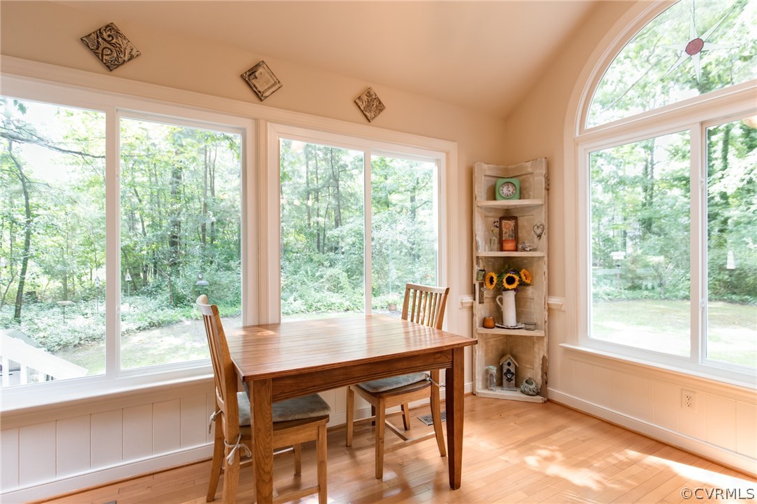 14215 Candlewick Road Midlothian, VA 23112 - Photo 17 of 39 a view of a dining room with furniture large windows and wooden floor