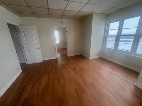 365 Lindsey Street, Unit 2 Fall River, MA 02720 - Photo 9 of 9 wooden floor in an empty room with a window