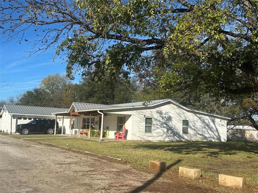 101 Twin Creek Road Comanche, TX 76442 - Photo 2 of 28 a view of house with garden