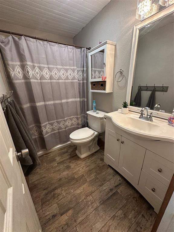 101 Twin Creek Road Comanche, TX 76442 - Photo 27 of 28 a bathroom with a sink toilet and shower