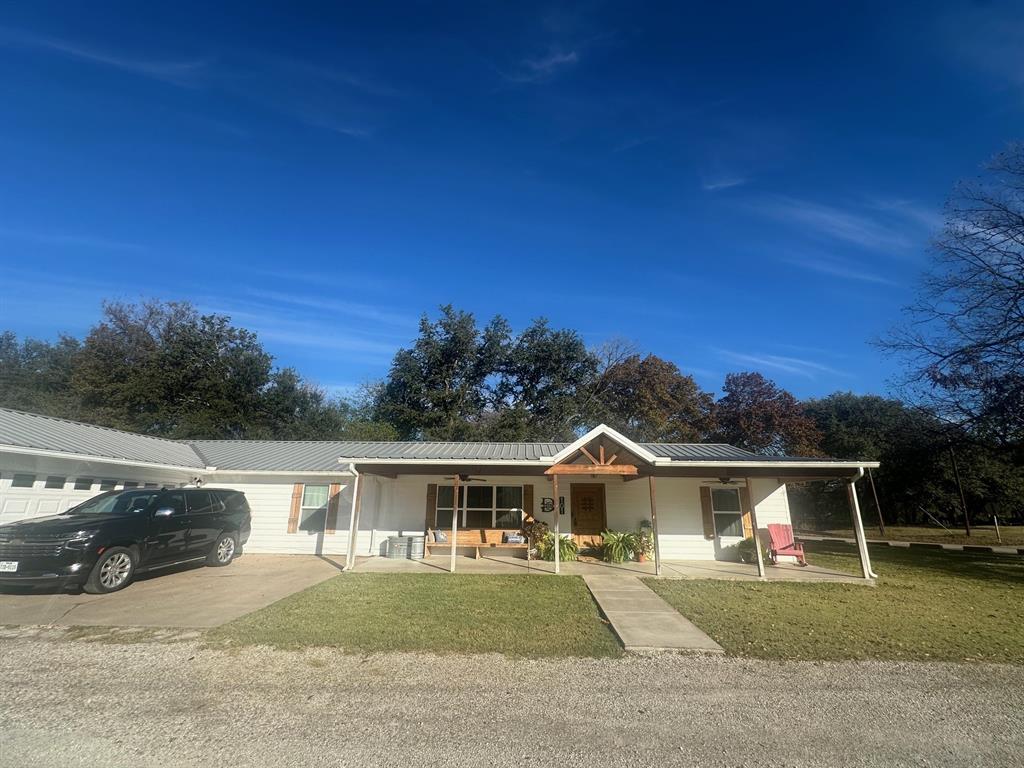 101 Twin Creek Road Comanche, TX 76442 - Photo 3 of 28 a front view of a house with a yard