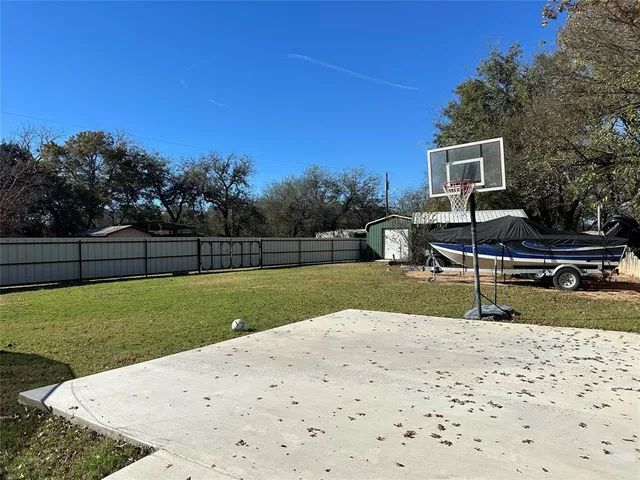 a living room with furniture fireplace and a window