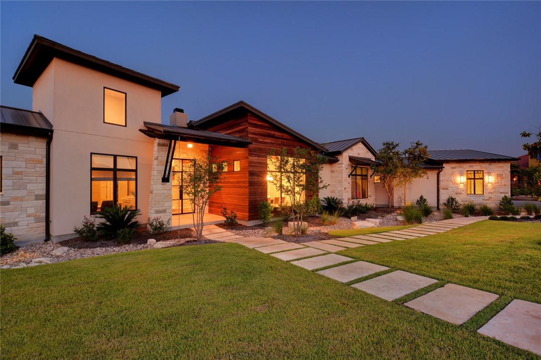 12804 Hacienda Ridge Austin, TX 78738 - Photo 1 of 1 a front view of a house with a yard