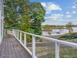 a view of a balcony with wooden floor