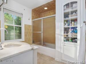 201 Shore Road Greenwich, CT 06830 - Photo 11 of 29 a bathroom with a sink and a shower