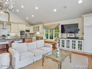 201 Shore Road Greenwich, CT 06830 - Photo 13 of 29 a living room with furniture and a table