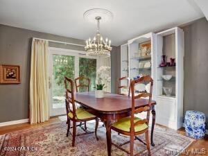 201 Shore Road Greenwich, CT 06830 - Photo 16 of 29 a view of a dining room with furniture window and wooden floor