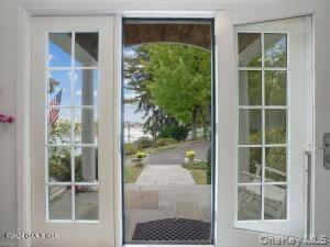 201 Shore Road Greenwich, CT 06830 - Photo 20 of 29 a view of a glass door with a door