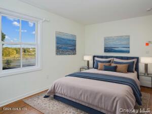 201 Shore Road Greenwich, CT 06830 - Photo 8 of 29 a bedroom with bed and a window