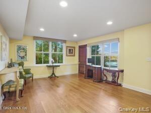 201 Shore Road Greenwich, CT 06830 - Photo 9 of 29 a living room with furniture and a large window